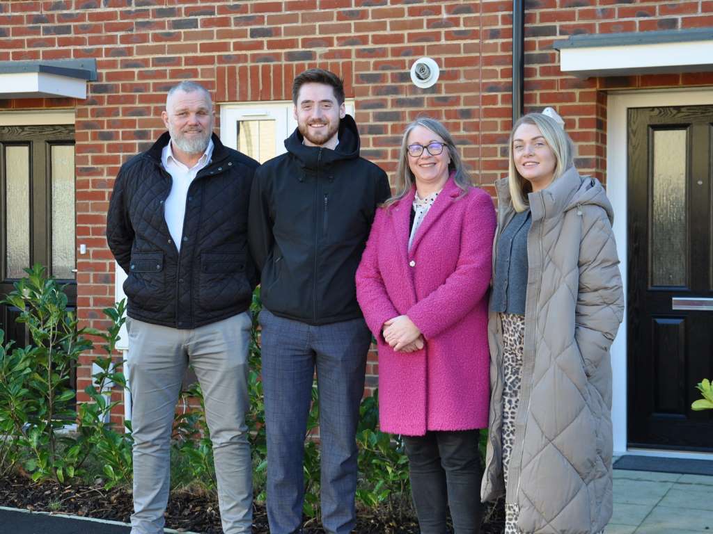 VIVID and Foreman Homes staff stood in front of houses